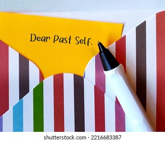 Yellow Card In Colorful Envelope With Handwriting DEAR PAST SELF, Concept Of Self Reflection - Writing Letter To The Person You Were, Advice To Give To Tell About What Happened Then And Now