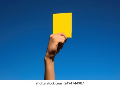 A yellow card. Warning. The game is on the verge of a foul - Powered by Shutterstock