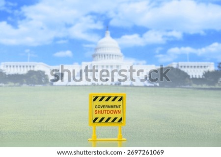 Yellow caution sign reading “Government Shutdown” placed in front of the U.S. Capitol Building. Concept of federal shutdown, budget impasse, economic risk and political standoff.