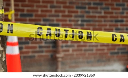 yellow caution tape signals danger and restriction. Its bright color symbolizes warning and attention. A visual cue to stay safe and avoid potential hazards