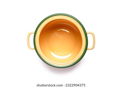 Yellow ceramic cooking pot or saucepan isolated on white background with clipping path, top view, flat lay.