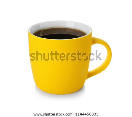 Yellow ceramic cup with hot aromatic coffee on white background