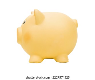 Yellow ceramic piggy bank isolated on white background