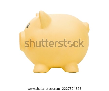 Yellow ceramic piggy bank isolated on white background
