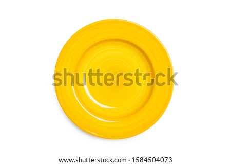 A yellow ceramic round plate on a white background