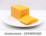 YELLOW CHEESE BAR (PLATE) SNACK SLICED ON A DISH ISOLATED ON A WHITE BACKGROUND