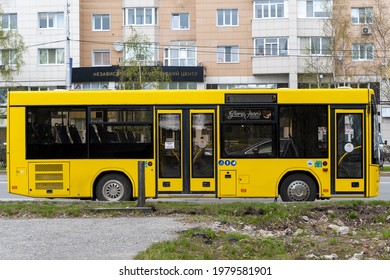 Yellow City Bus. In City Of Day. Side View. Surgut, Russia - 17, May 2021.