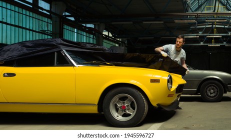 Yellow Classic Car  Unveiling In The Garage