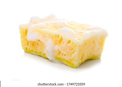 Yellow cleaning sponge in soap foam on white background isolation