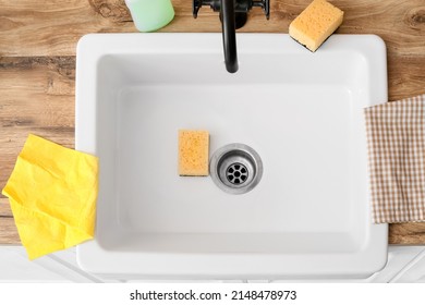 Yellow Cleaning Sponges In Ceramic Sink