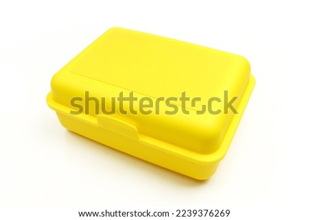 Yellow closed plastic lunch box case isolated on white background