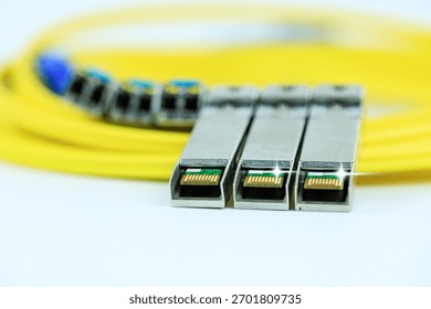Yellow coiled fiber optic patch cord with blue connectors SFP modules are essential for high-speed data transmission over fiber optic networks.