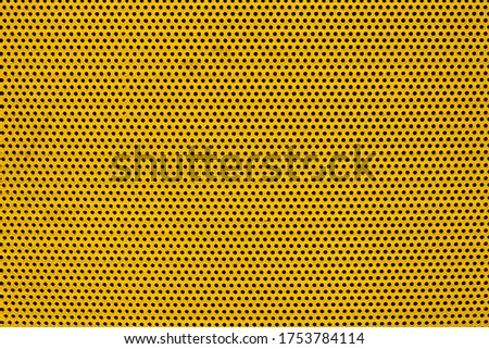 yellow color metal plate with many small circular holes dots texture for background