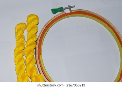 Yellow Colored Wool Yarn Bunch With Hand Wood Circle Frame For Embroidery