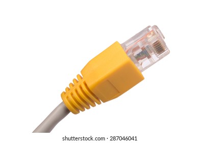 Yellow computer cable on isolated white background, close-up view