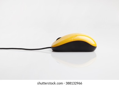 Yellow Computer Mouse With A Thin Wire