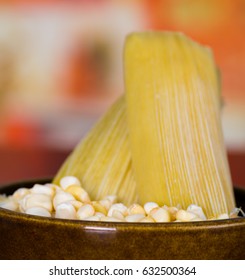 A Yellow Corn Inside Of A Crock Pot With A Couple Of Humitas