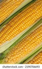 Yellow Corn With The Kernels, Cobs. Not Ideal Organic Vegetables. Background. Vertical Diagonal Stripes.