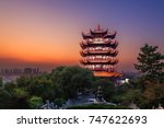 Yellow Crane Tower at twilight, the traditional Chinese multi-storey tower located on Sheshan (Snake Hill) in Wuhan, Hubei, China, 4 Chinese letters on tower is "Mu Ji Tian Chu" means "amazing heaven"