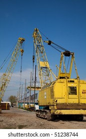 Yellow cranes at an industrial site in Romania.