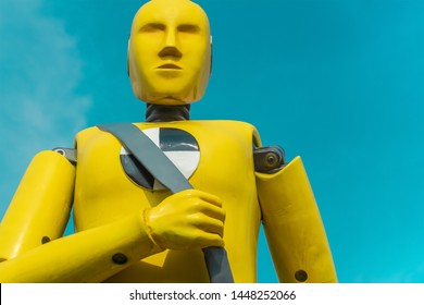 yellow crash test dummy on aqua sky background - Shutterstock ID 1448252066