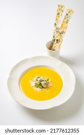 Yellow Cream Cheese Soup In A White Plate