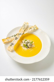 Yellow Cream Cheese Soup In A White Plate