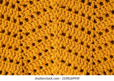 Yellow Crochet Texture With Chevron Stitch Close Up. Crochet Fabric With Zigzag Pattern.