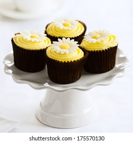 Yellow Cupcakes On A White Cakestand