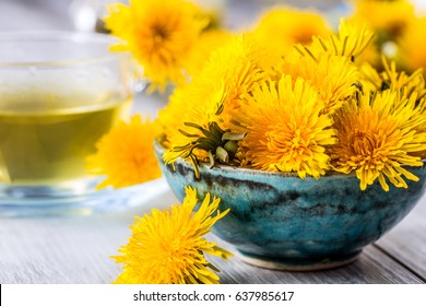 Yellow Dandelion Heads In Bowl Or Table.