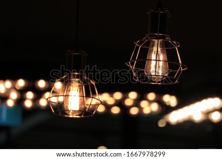 Yellow decorative light bulbs in cafe. 