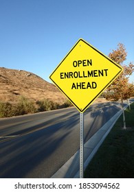 Yellow Diamond Road Sign Announcing Open Enrollment Ahead