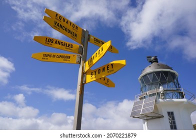 Yellow direction sign post in the northern point of New Zealand Cape Reinga - Shutterstock ID 2070221879