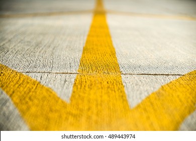 Yellow Direction Strips Closeup On An Airfield Runway.