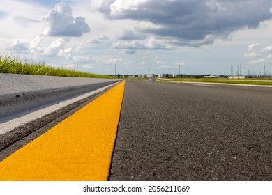 Yellow Dividing Line Running Down Empty New Paved Road Asphalt Black No Cars Low Angle