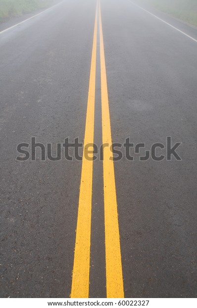yellow dividing lines on\
the highway