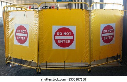 Yellow DO NOT ENTER  Construction Screen Barrier Inside Building.