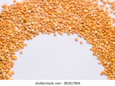yellow dry split peas isolated on white background