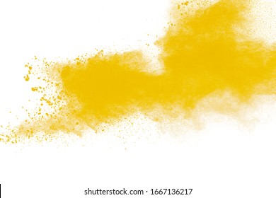 Yellow dust particles explosion on white background.Yellow powder dust splash.