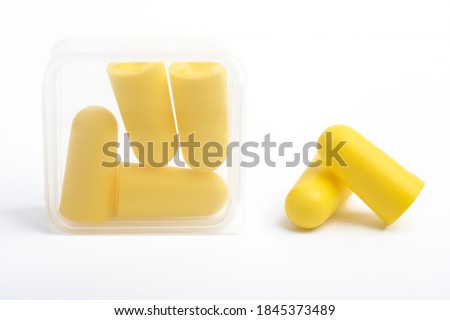 Yellow Ear plugs isolated on a white background