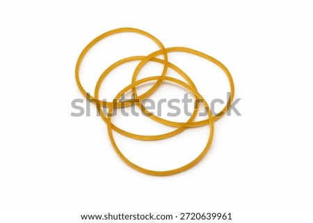 Yellow Elastic Rubber Bands Interlinked and Isolated on White Background