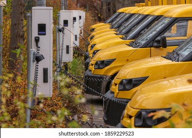 Yellow Electric Vehicles At The Charging Station