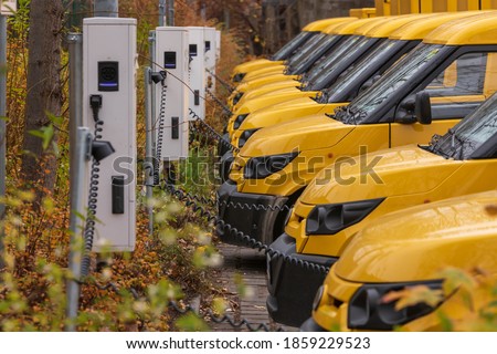 Yellow electric vehicles at the charging station