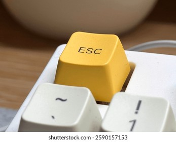 Yellow esc button at close range on mechanical keyboard for programmer