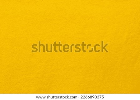 Yellow fabric texture background pattern of natural textile surface.