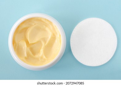 Yellow Facial Mask (banana Face Cream, Shea Butter Hair Mask, Body Butter) And Cotton Pad. Natural Skin And Hair Concept. Light Blue Background. Top View, Copy Space.