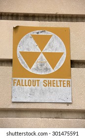 yellow fallout shelter sign on a building