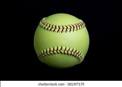 Yellow Fastpitch Softball On Black Background