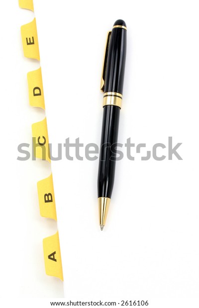 yellow\
file divider and pen, office supplies, close\
up