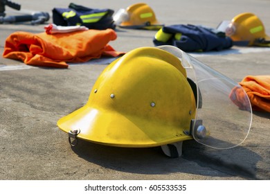 yellow fireman helmet and fireman suits

